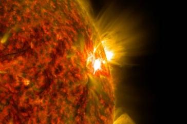 Solar flare bursts away from the surface of the sun.